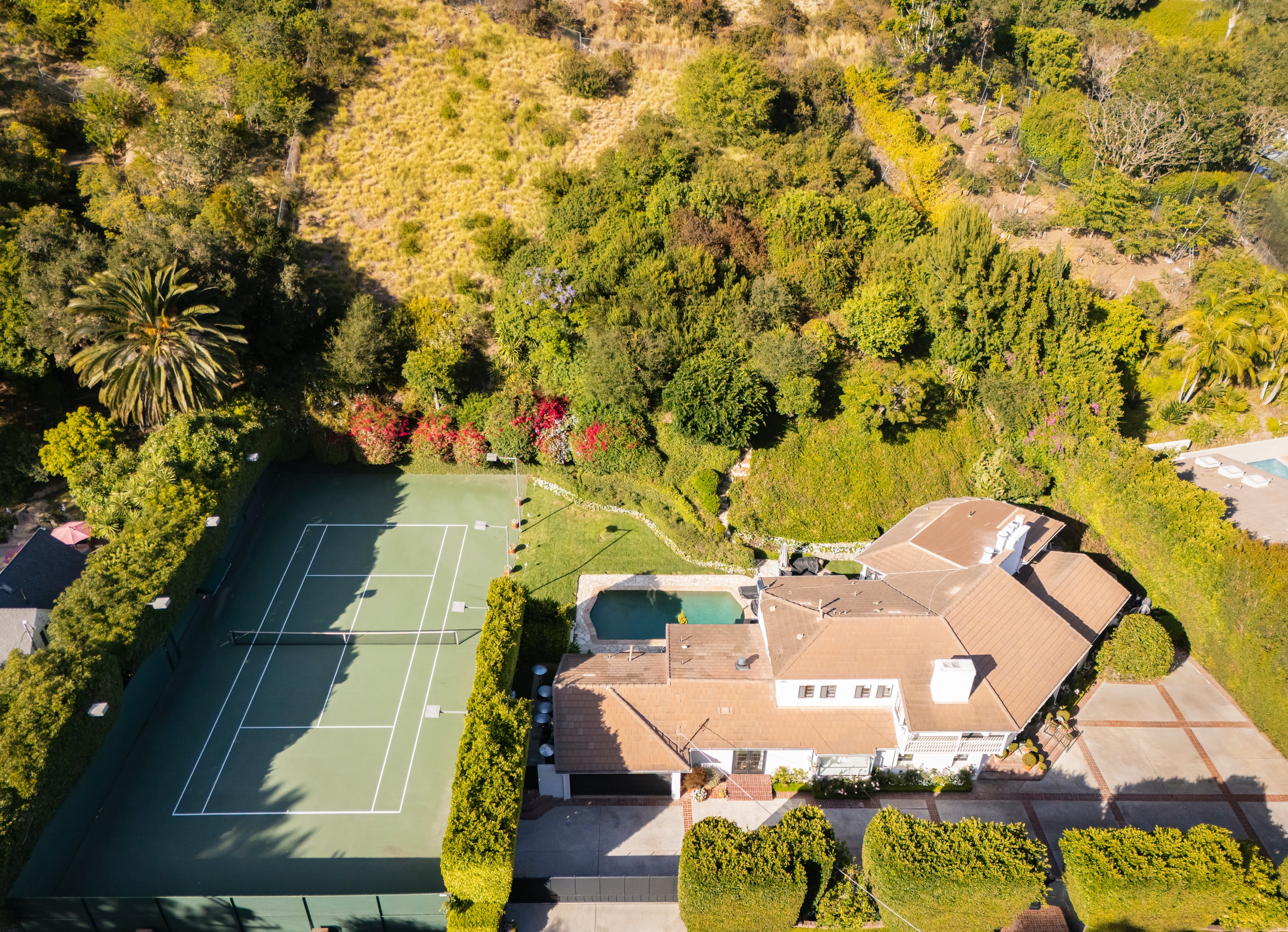 JUST LISTED!

760 N Beverly Glen Blvd
Offered at $8,995,000

A championship tennis court, more than an acre of impeccably landscaped grounds