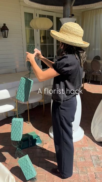A florist hack for a cascading asiatic lily moment

Start with a saddle with wet foam at the top and another saddle with wet foam at the bottom. Connect the two with chicken wire dry-foam burritos to create your cascade 