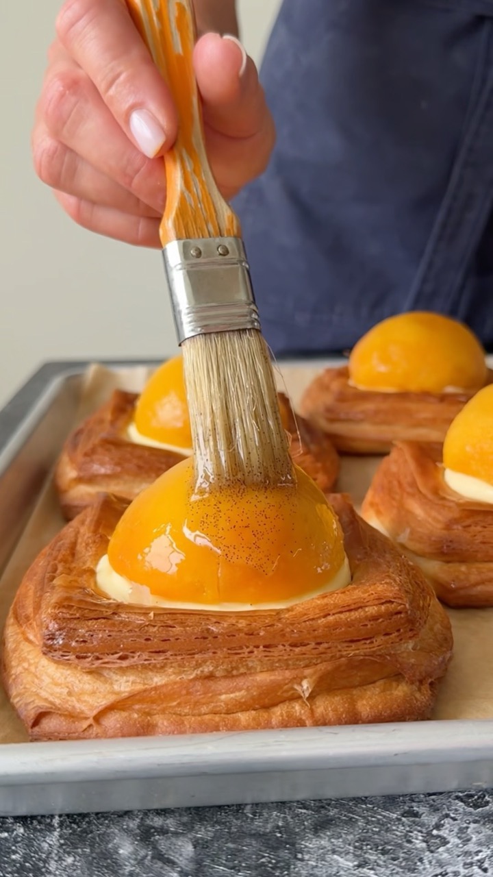 Croissant danish with peach compote cremè fraiche custard and poached peach with vanilla syrup